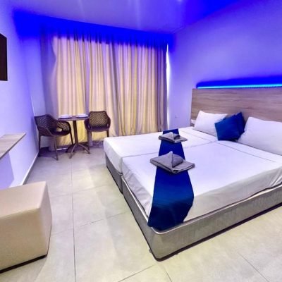 Superior hotel room with a large bed and modern decor.