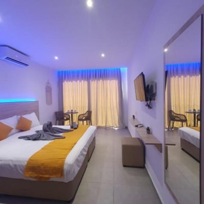 Modern Superior Studio in Ayia Napa featuring a comfortable double bed, stylish sitting area, and contemporary hotel design perfect for couples or solo travelers.