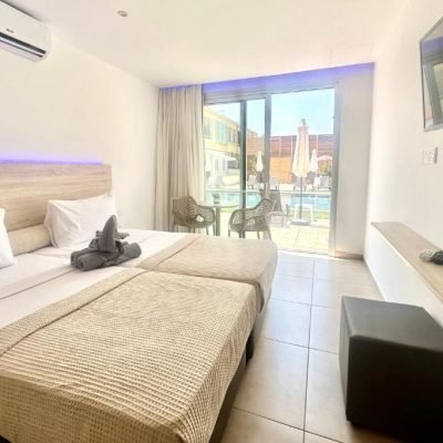Superior hotel room with a large bed and modern decor.